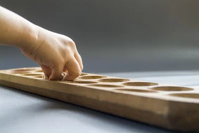 Kids Play Mancala