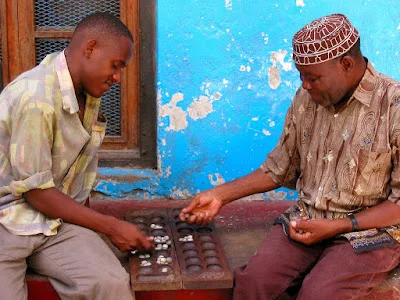 Brothers Playing Mancala