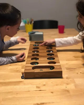 Children Learning Mancala